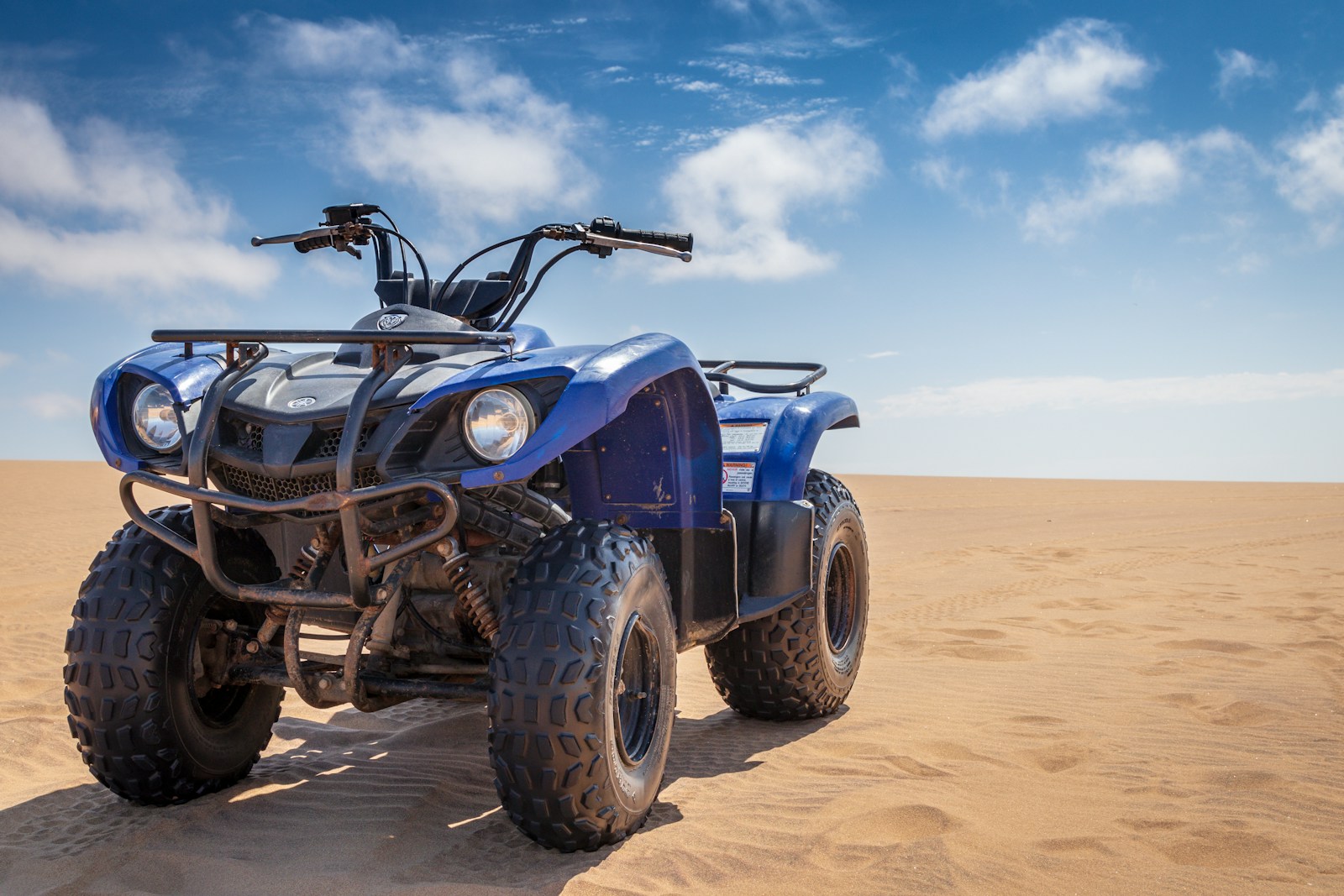 blue ATV on desert, homeowners